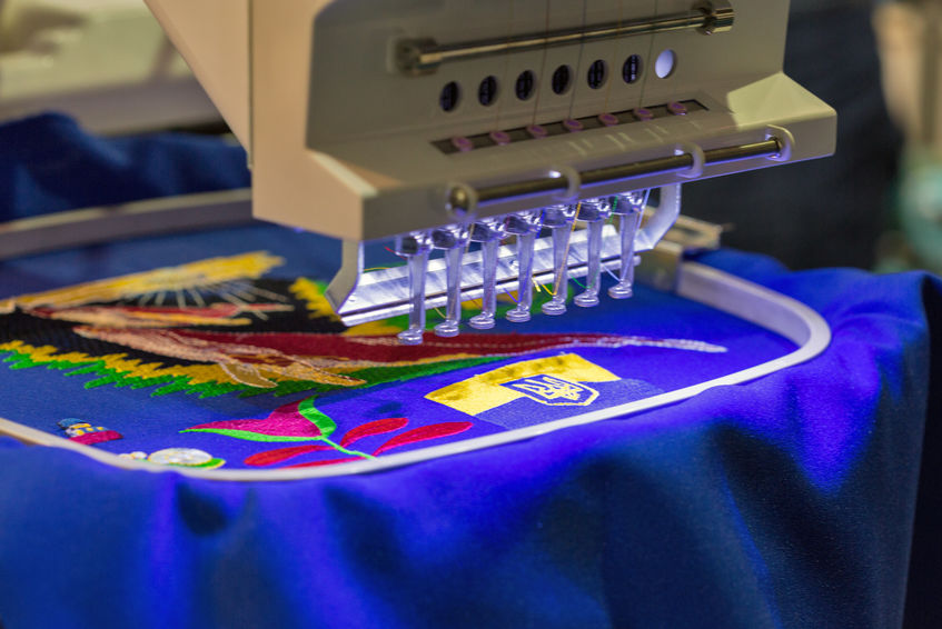 Professional machine for applying embroidery closeup